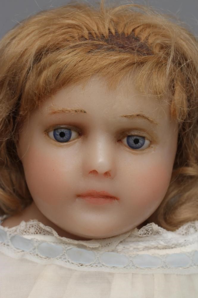 A large Victorian wax shoulder head doll Image