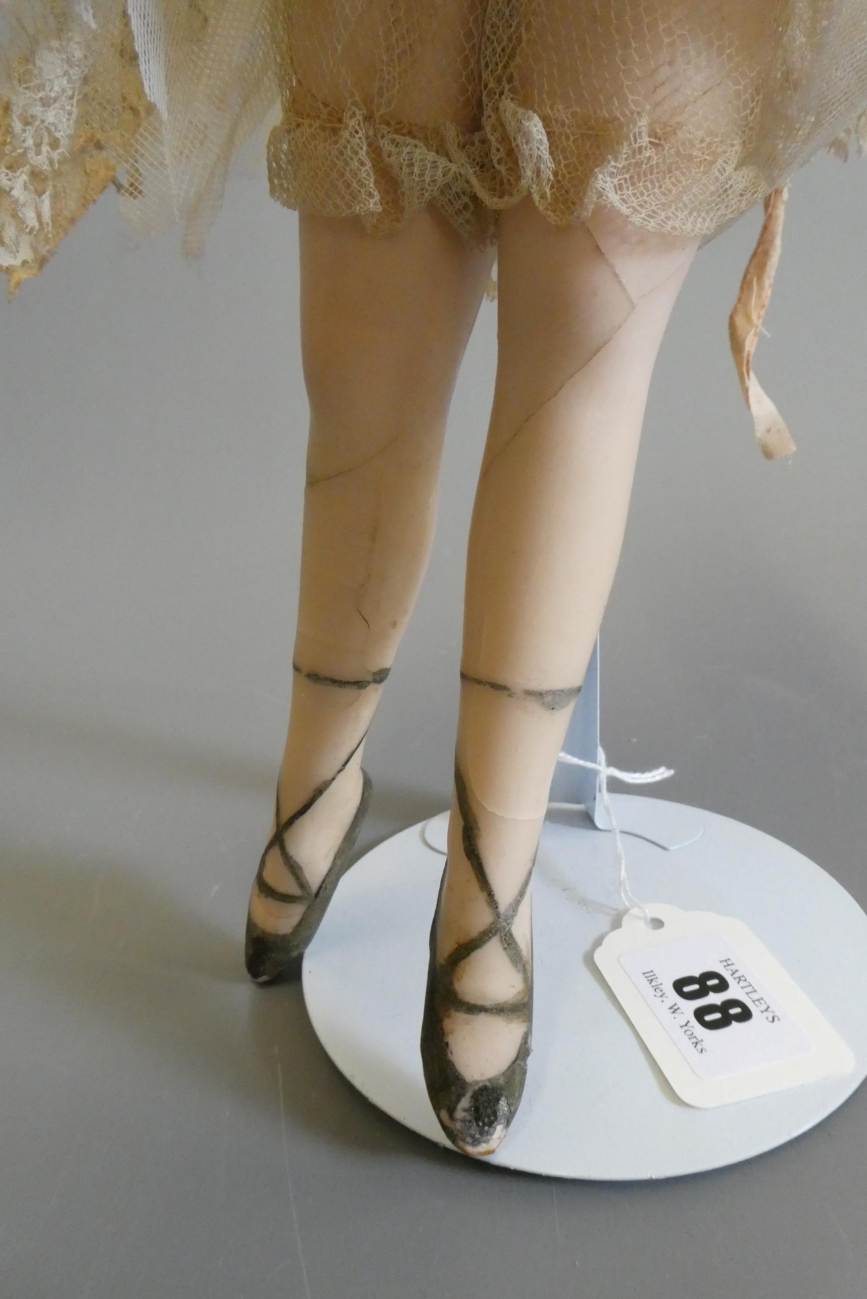 An early 20th century all wax ballerina doll, with moulded features, blond wig, wire joined arms, Image