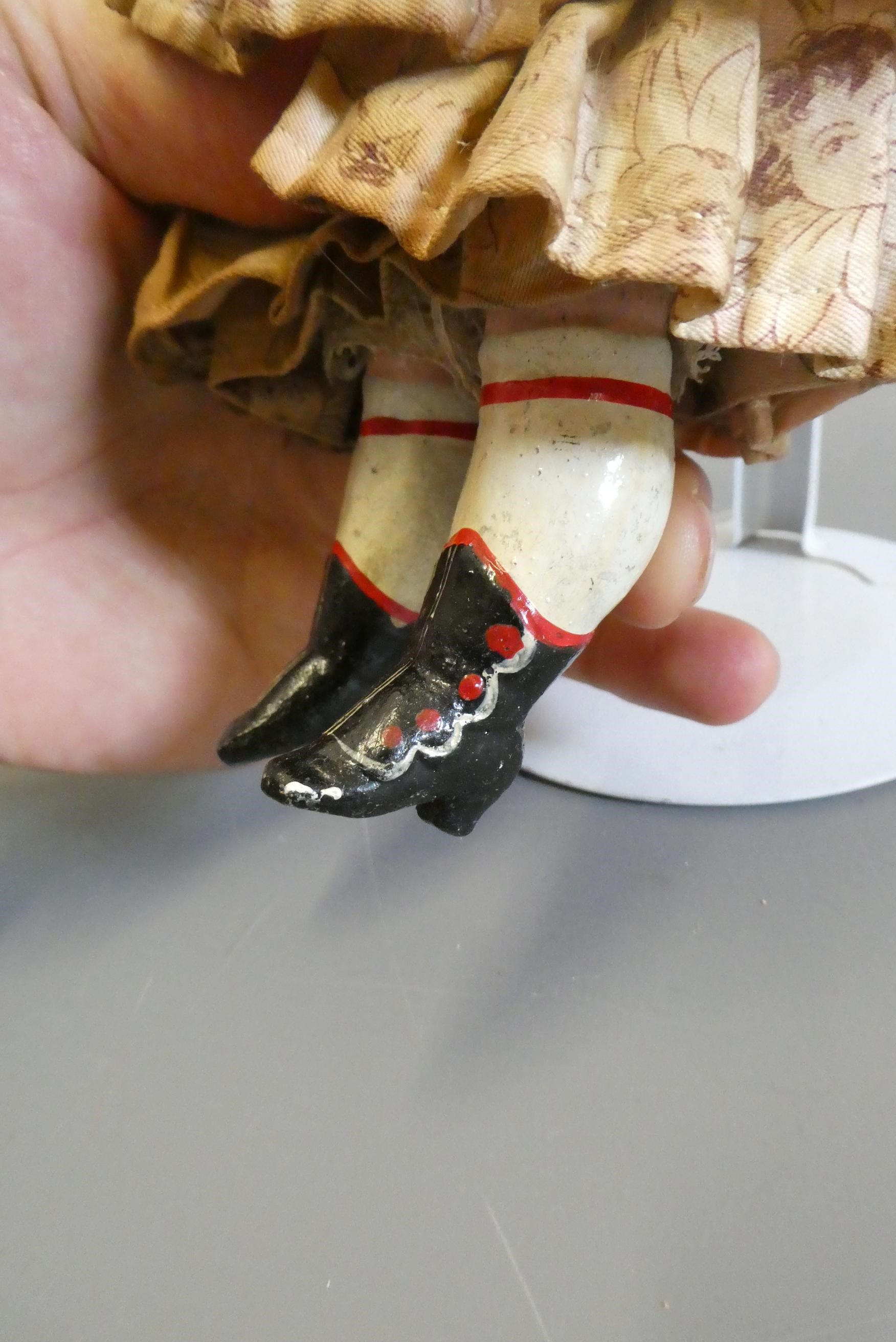 A Victorian wax shoulder head doll Image