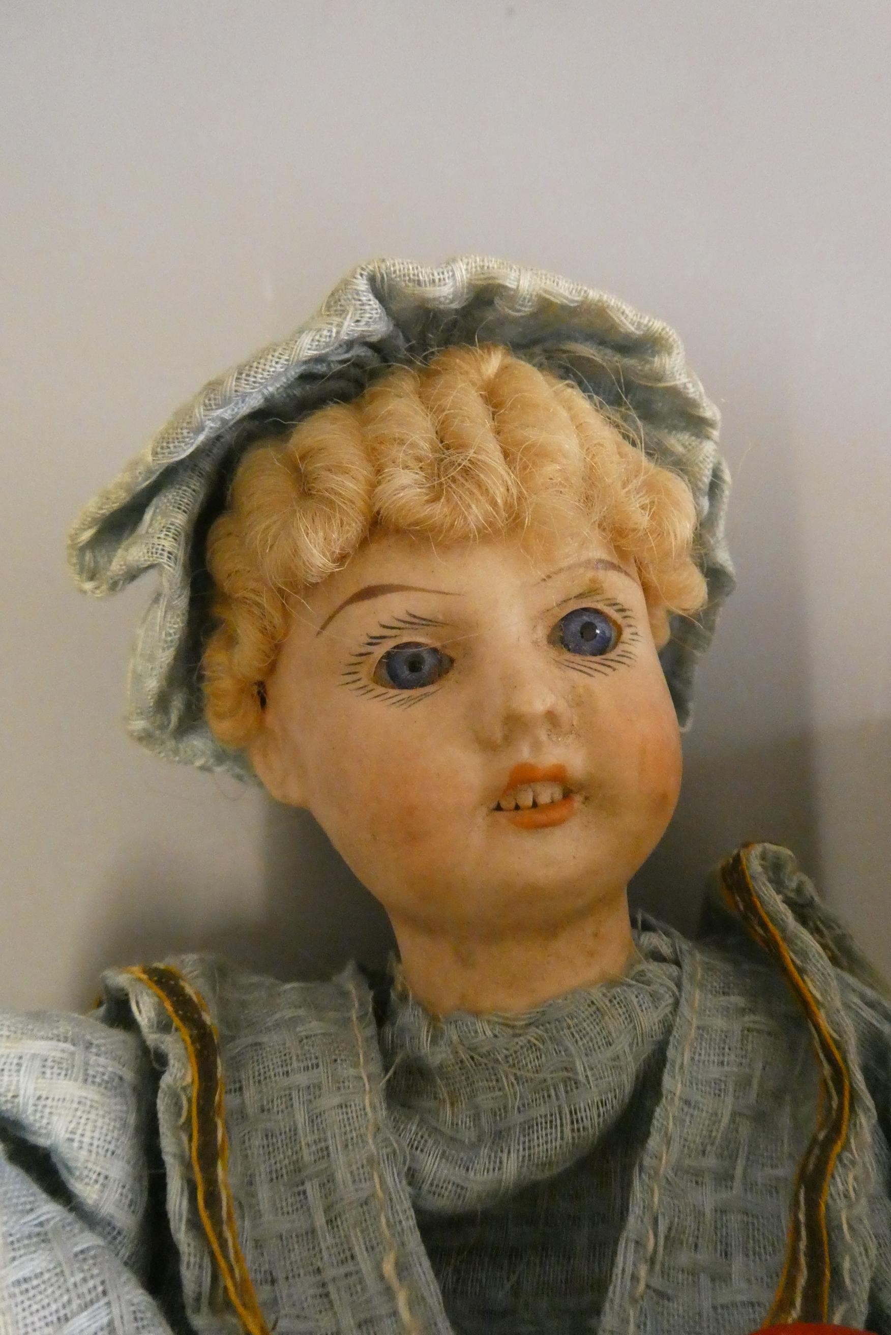 Two mechanical bisque head dolls Image