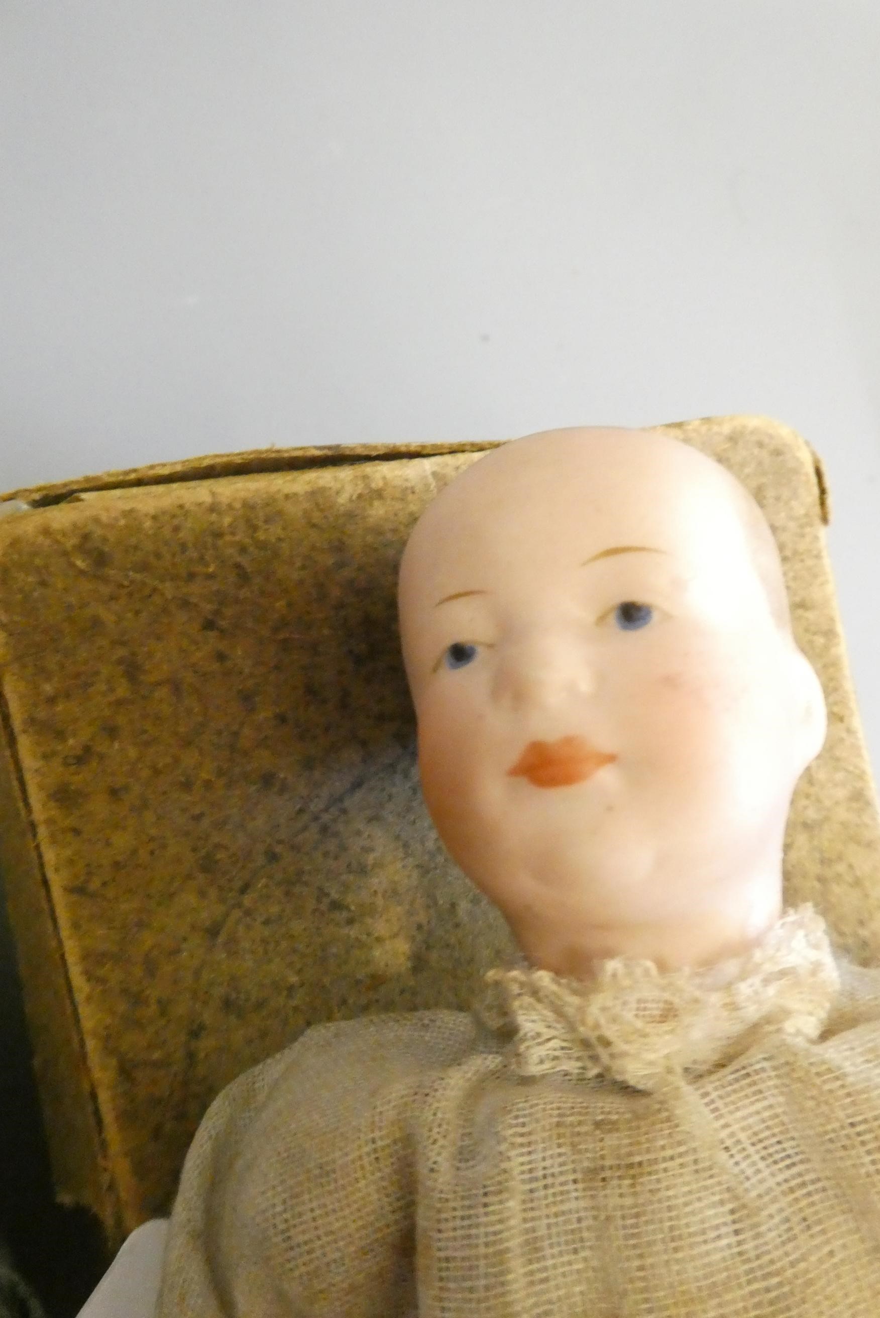 Two mechanical bisque head dolls Image