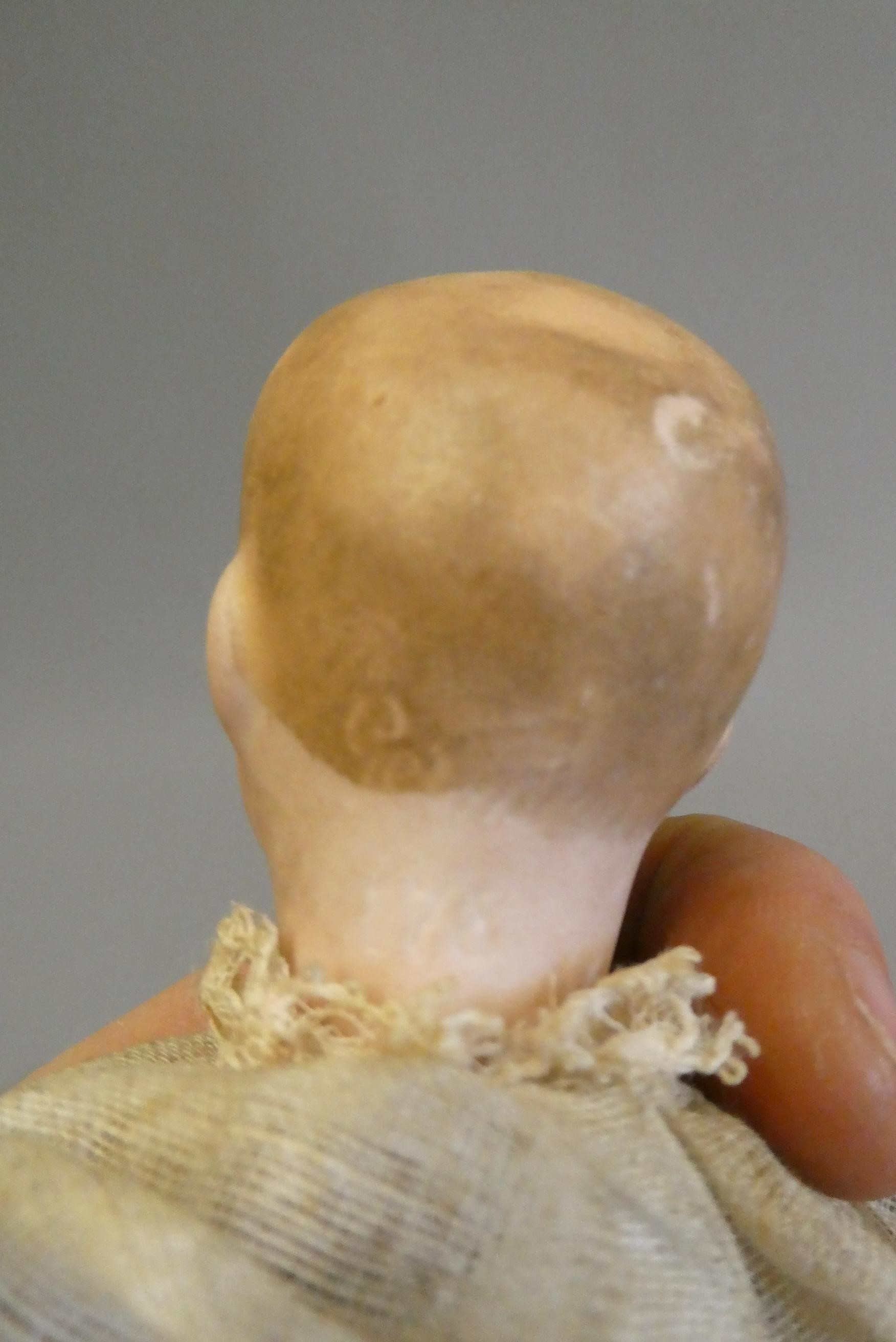 Two mechanical bisque head dolls Image
