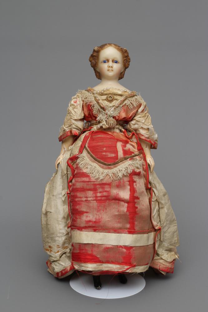 A Victorian wax shoulder head doll Image