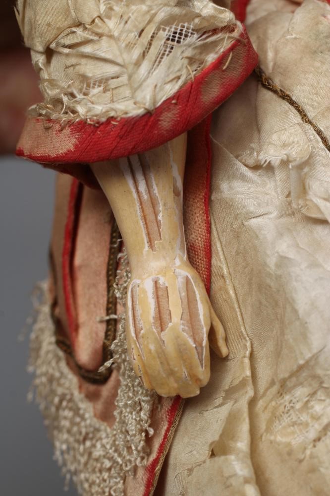 A Victorian wax shoulder head doll Image