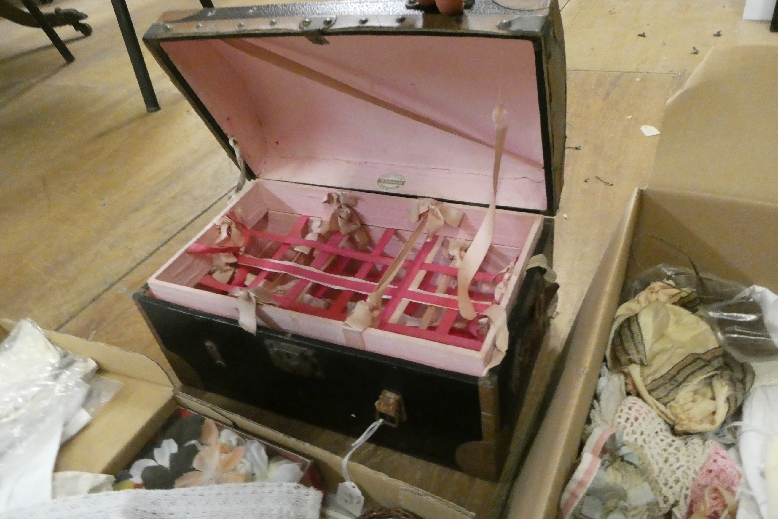 Two boxes of doll's clothing and accessories, together with doll stands and a trunk (Est. plus 24% Image