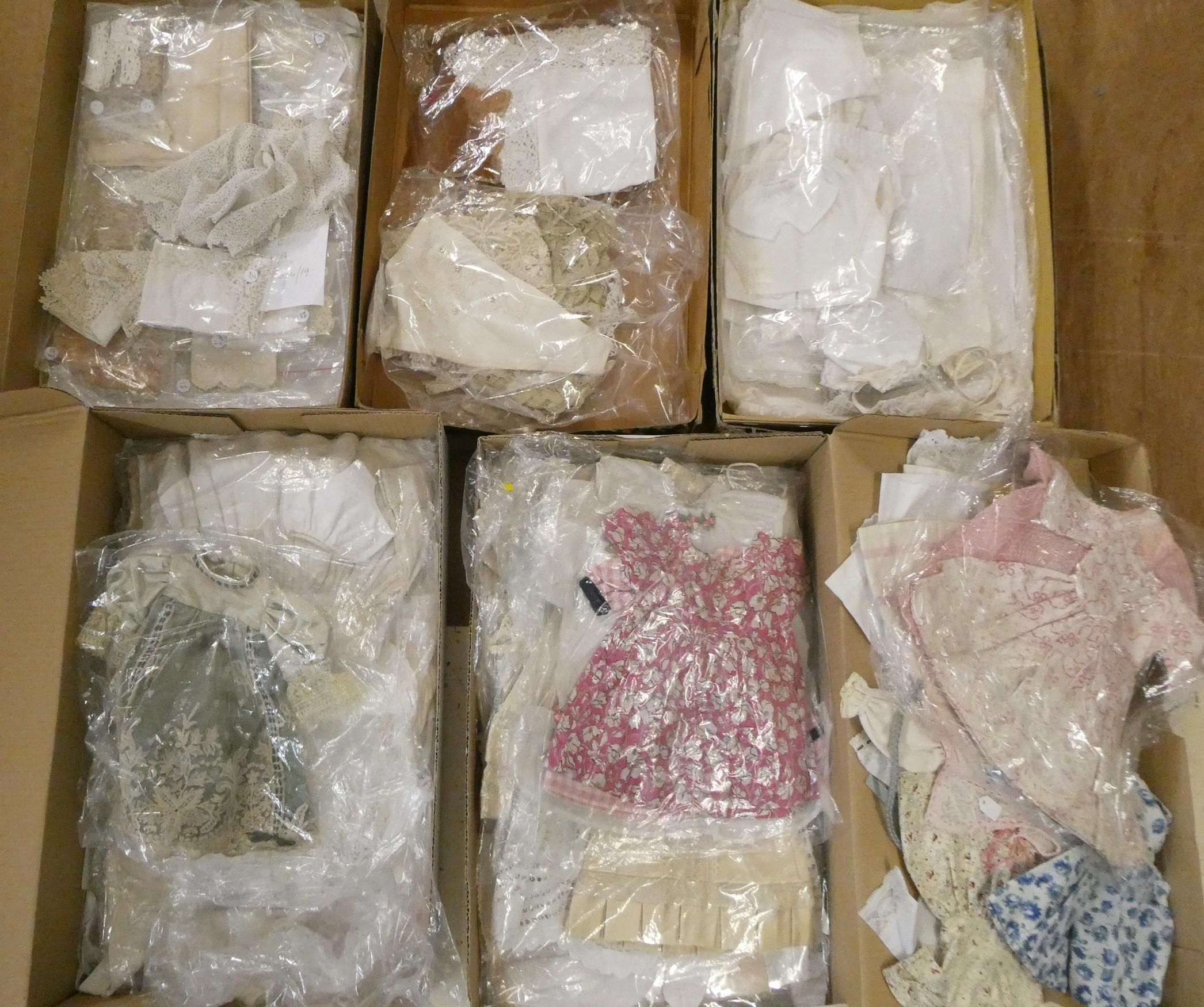 Four boxes of doll's antique and later clothing (Est. plus 24% buyer's premium inc. VAT) Image