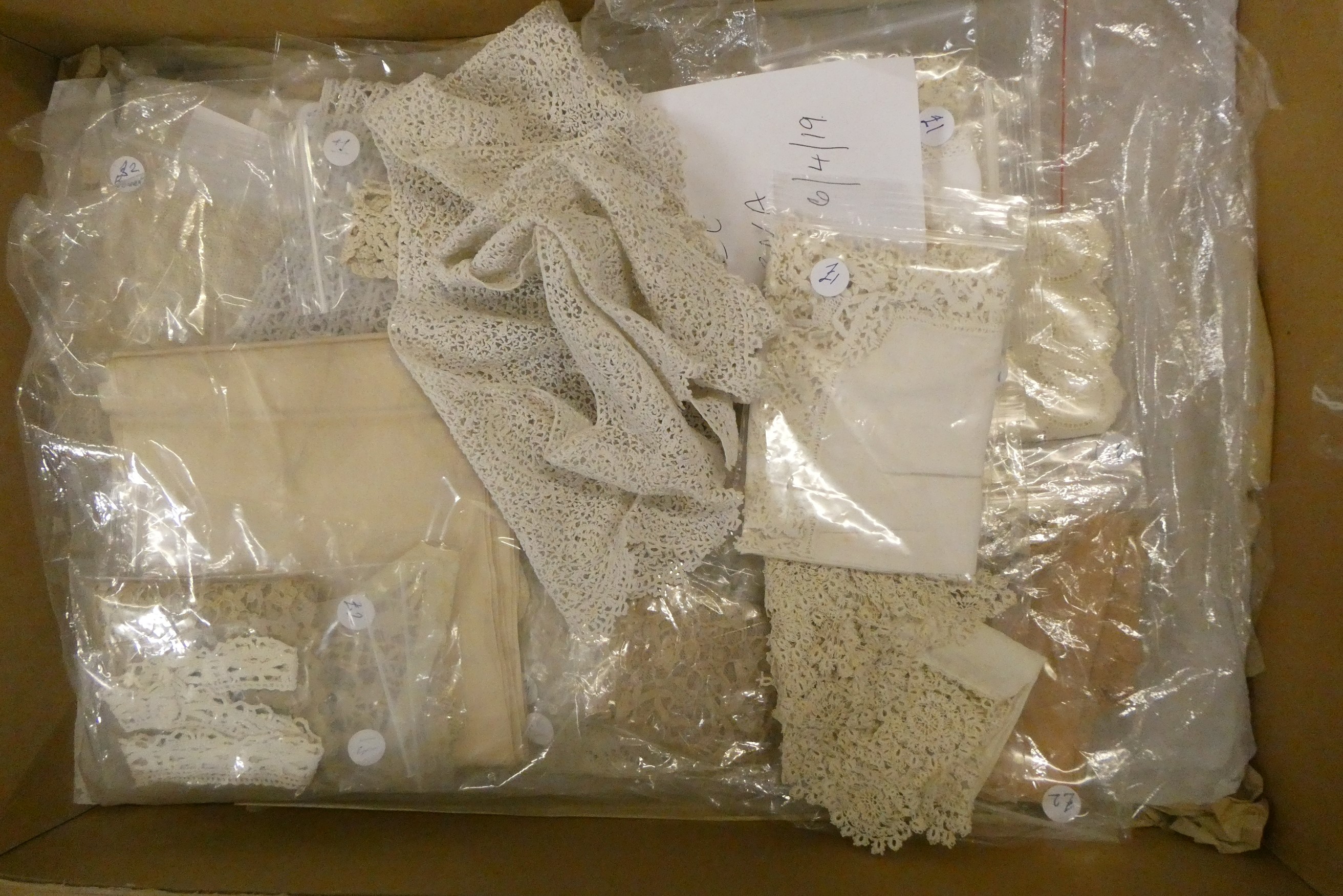 Four boxes of doll's antique and later clothing (Est. plus 24% buyer's premium inc. VAT) Image