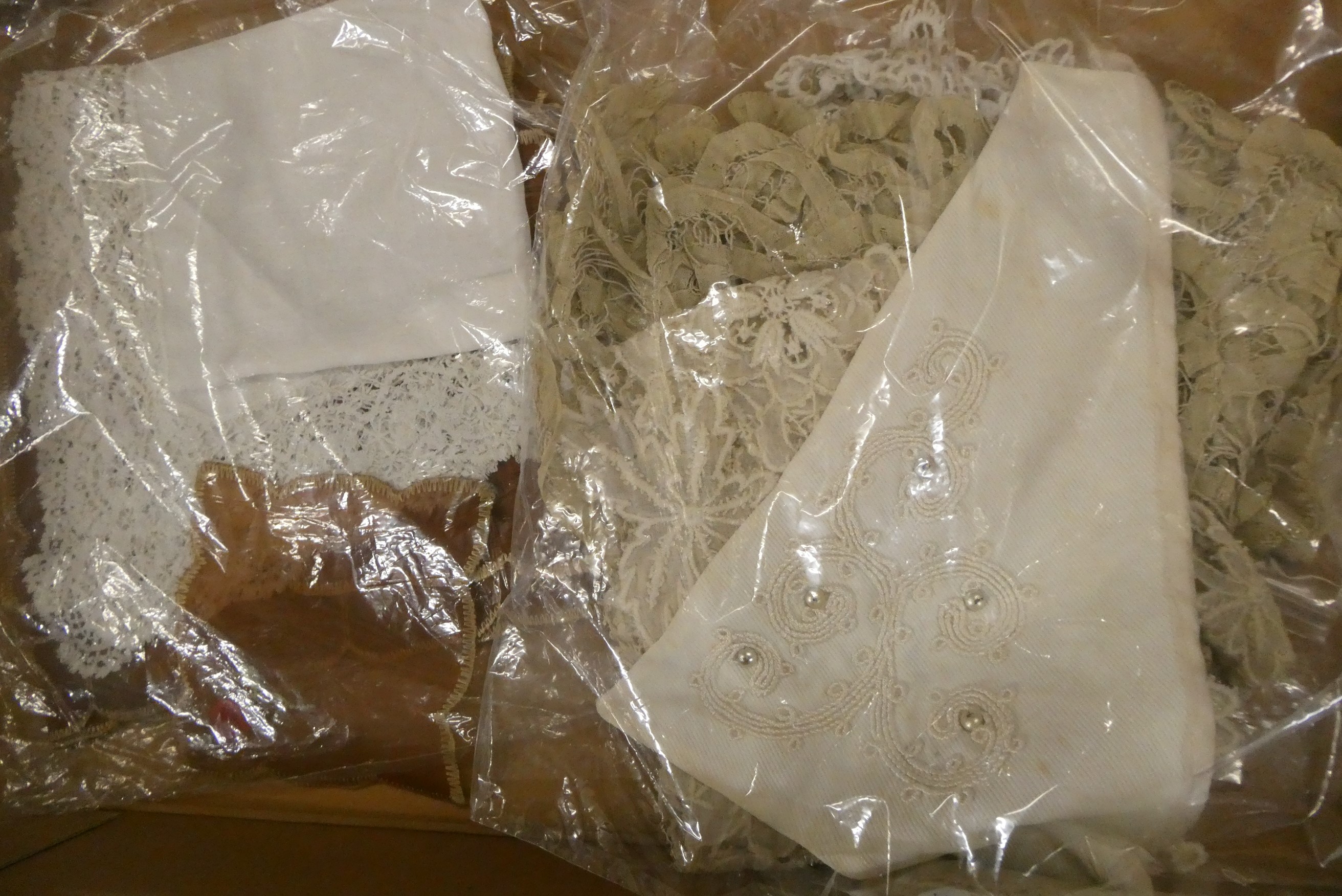 Four boxes of doll's antique and later clothing (Est. plus 24% buyer's premium inc. VAT) Image