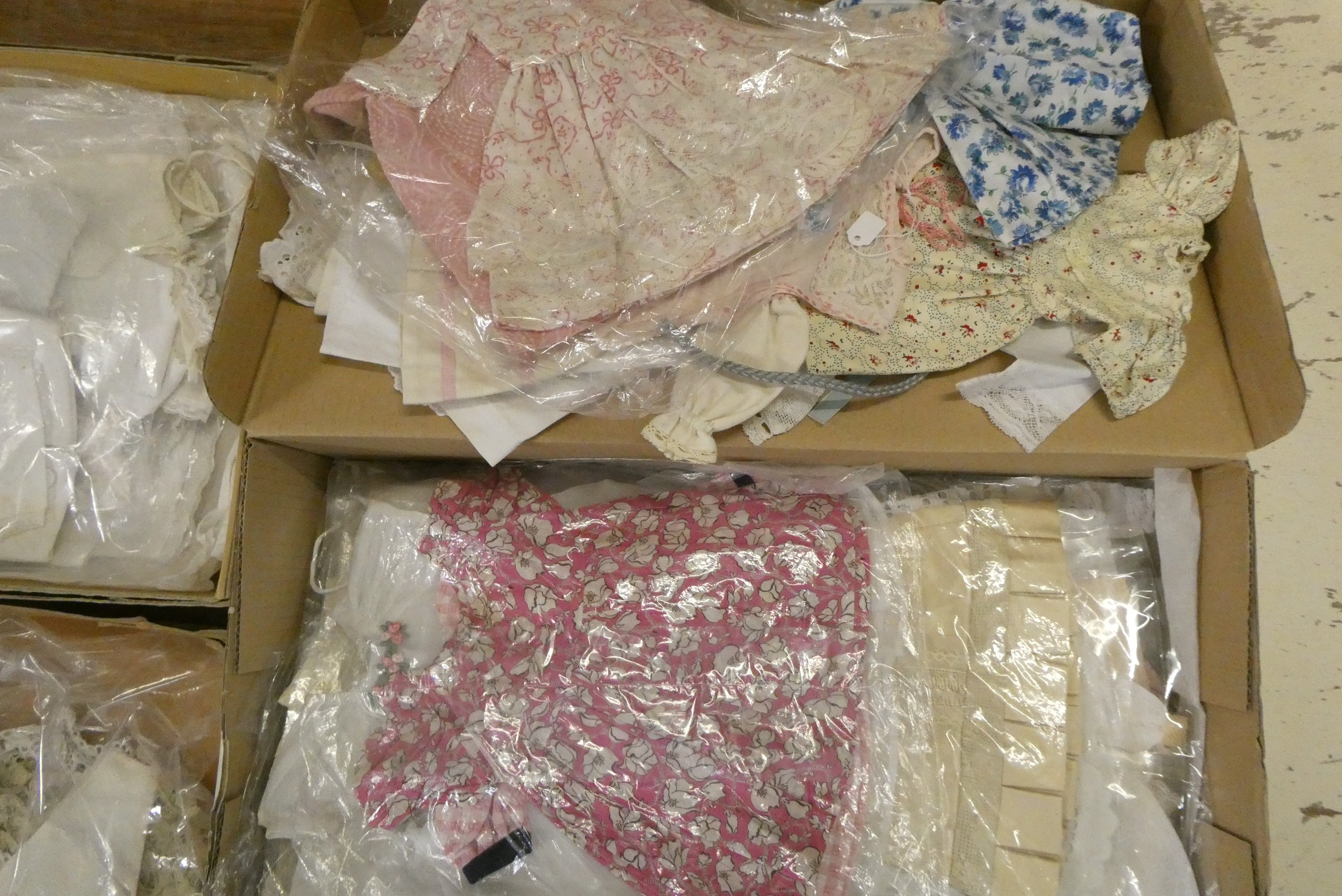 Four boxes of doll's antique and later clothing (Est. plus 24% buyer's premium inc. VAT) Image