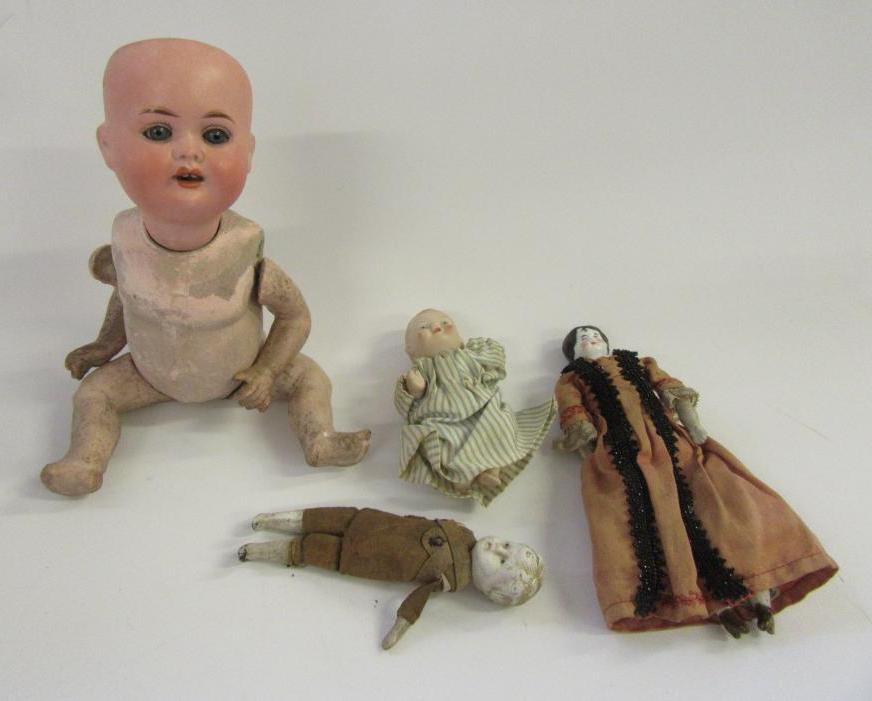 A Theodor Recknagel bisque head doll with blue glass sleeping eyes Image