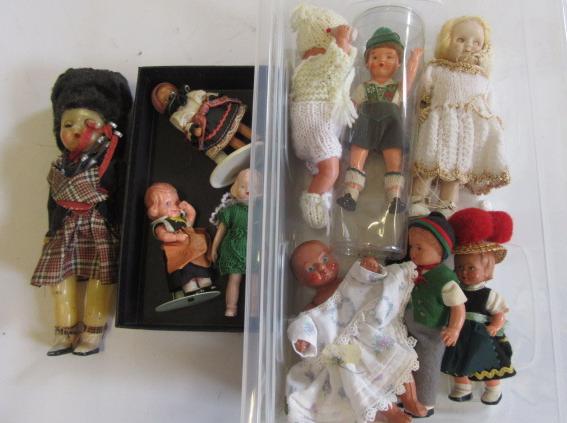 Nine various small plastic costume dolls Image