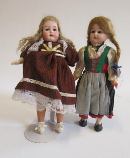 A small Armand Marseille bisque head doll with fixed brown glass eyes Image