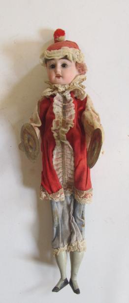 A cymbals doll with bisque head Image