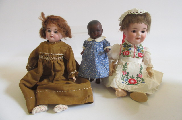 An Armand Marseille bisque head character doll with brown glass sleeping eyes Image