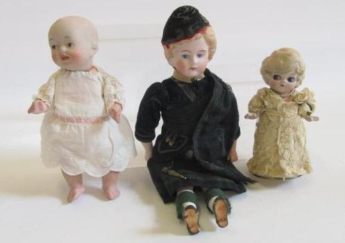 A bisque shoulder head doll with intaglio eyes Image