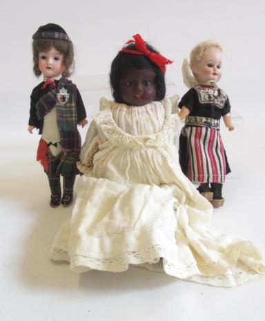 A German bisque head doll with jointed composition body and limbs in full Highland outfit Image