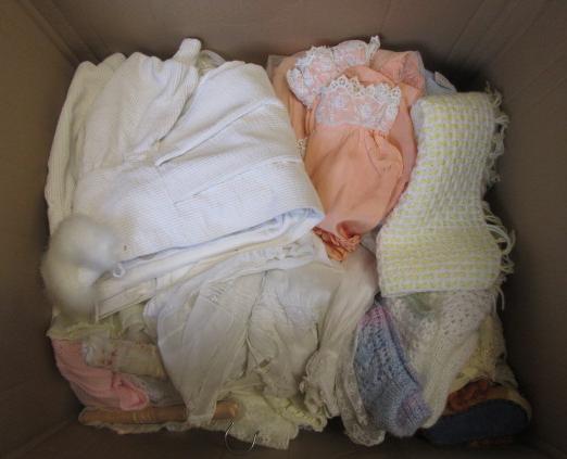 A large quantity of dolls clothing including boots Image