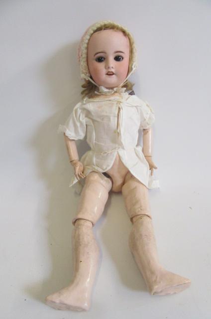 An S.F.B.J. bisque head doll with brown glass sleeping eyes Image