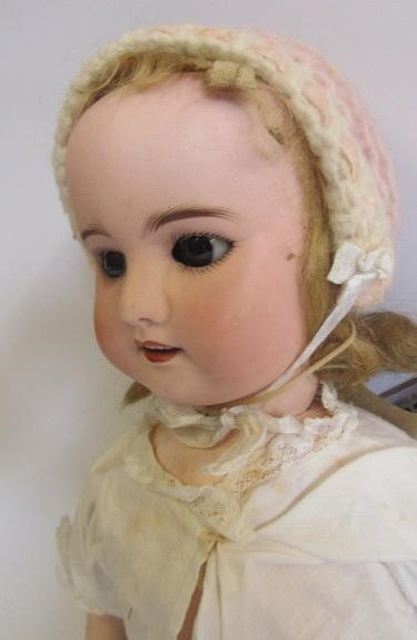 An S.F.B.J. bisque head doll with brown glass sleeping eyes Image