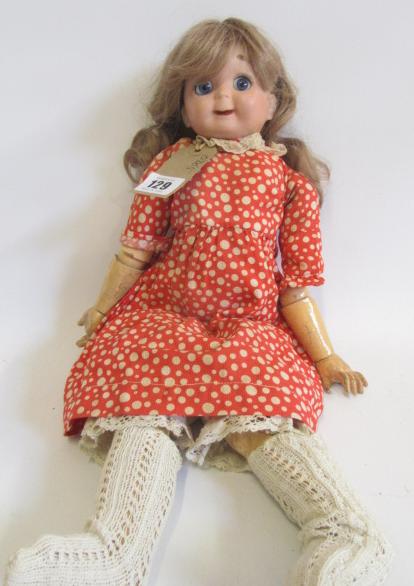 A J.D. Kestner bisque head googly eyed doll with fixed blue paperweight glass eyes Image