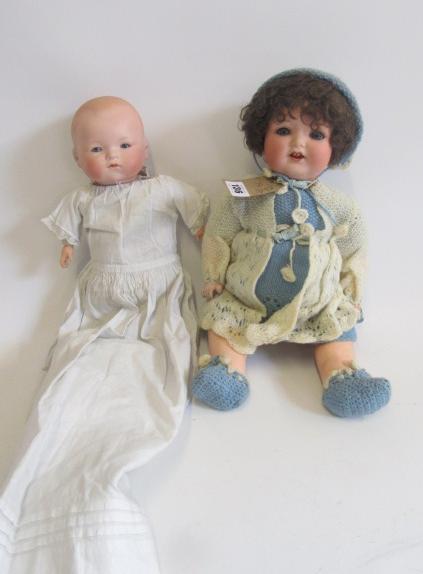 An Armand Marseille bisque head character doll with blue glass sleeping eyes Image