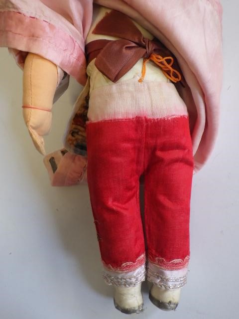 An Armand Marseille bisque socket head Oriental doll with brown glass sleeping eyes and painted face Image