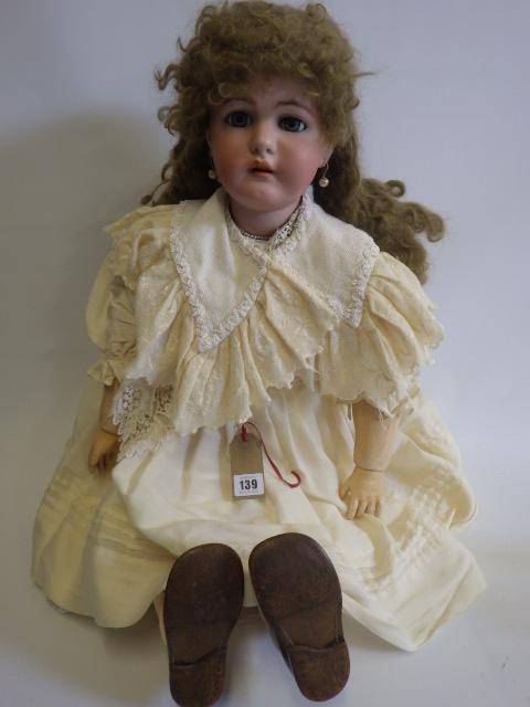 A large Simon & Halbig K & R bisque socket head doll with blue glass sleeping eyes Image