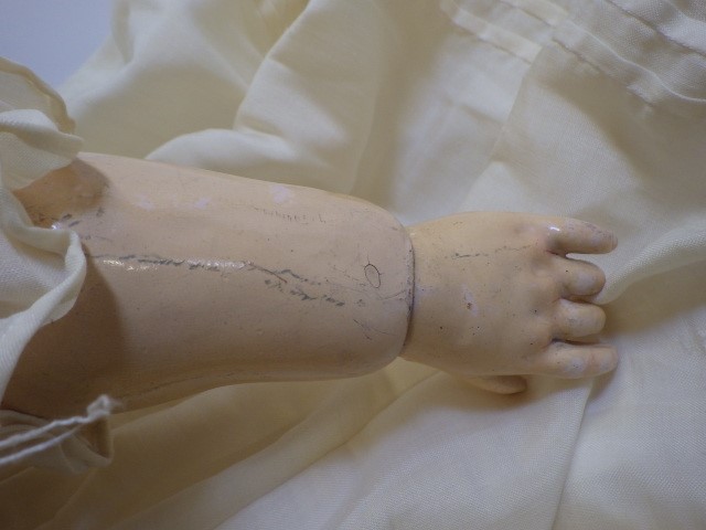 A large Simon & Halbig K & R bisque socket head doll with blue glass sleeping eyes Image