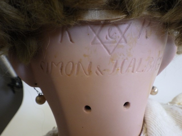 A large Simon & Halbig K & R bisque socket head doll with blue glass sleeping eyes Image