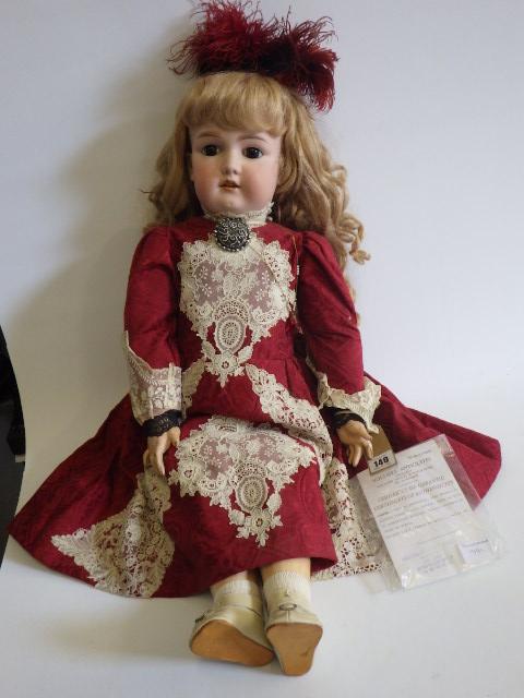 A large Armand Marseille bisque socket head doll with fixed brown glass eyes Image