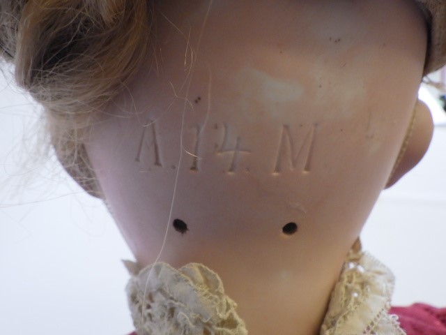 A large Armand Marseille bisque socket head doll with fixed brown glass eyes Image