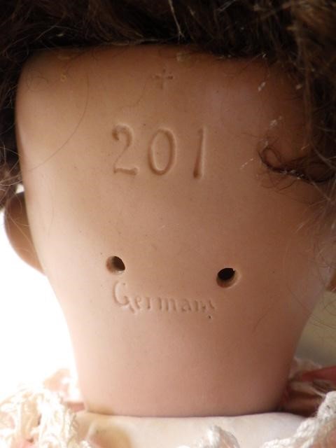 A German bisque socket head character crying doll with blue glass sleeping eyes Image