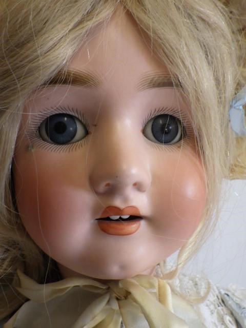 A large Simon & Halbig "P" bisque socket head doll with blue glass sleeping eyes Image
