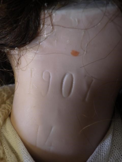 A large Jumeau bisque socket head doll with fixed blue glass eyes Image