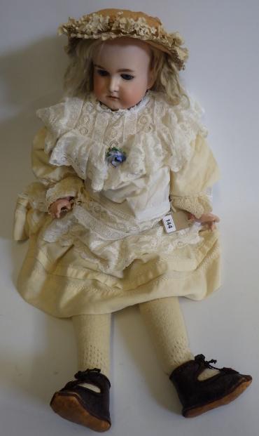 A large Armand Marseille bisque head and shoulders doll with fixed blue glass eyes Image
