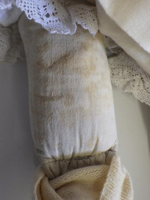 A large Armand Marseille bisque head and shoulders doll with fixed blue glass eyes Image