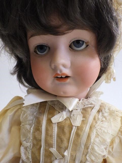 A German bisque socket head doll with sleeping blue glass eyes Image