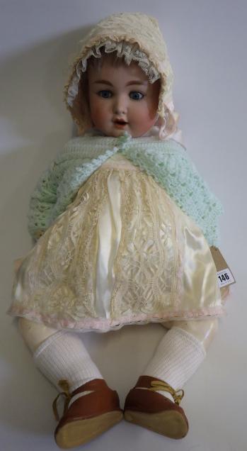 A Kammer & Reinhardt bisque socket head doll with sleeping blue glass eyes Image