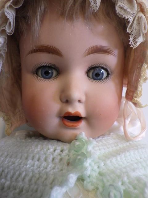 A Kammer & Reinhardt bisque socket head doll with sleeping blue glass eyes Image