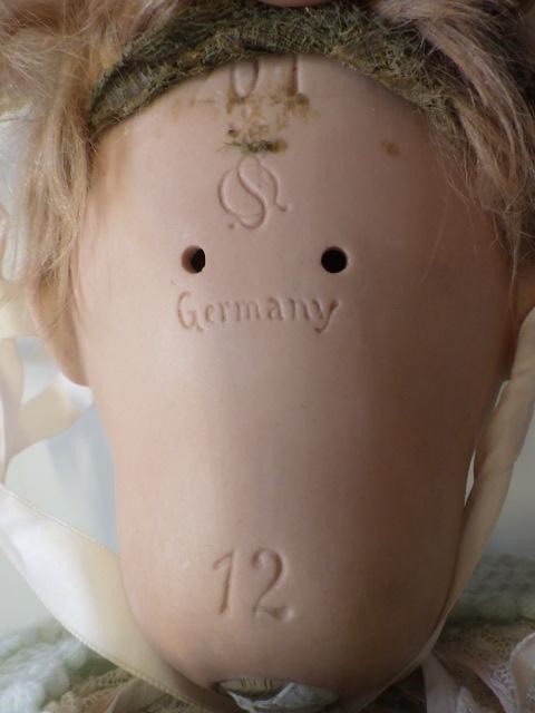 A Kammer & Reinhardt bisque socket head doll with sleeping blue glass eyes Image