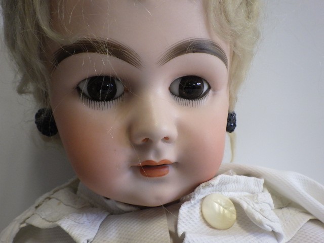 A large French bisque socket head doll Image