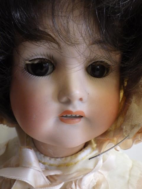 A German bisque socket head doll with sleeping brown glass eyes Image