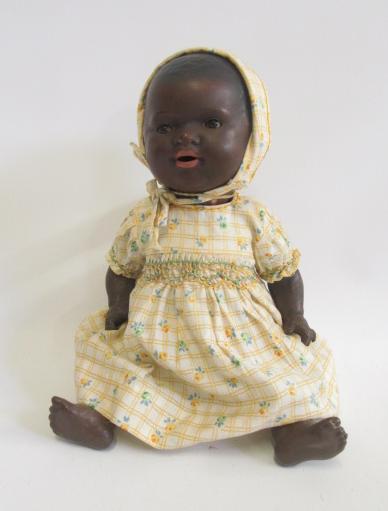 An Armand Marseille bisque head black baby doll with brown glass sleeping eyes Image