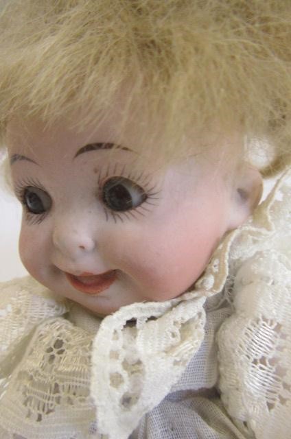 An all bisque googly eyed doll by Hertel Image