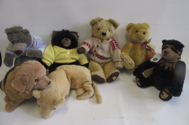 A mid 20th century English teddy bear with faded gold plush Image