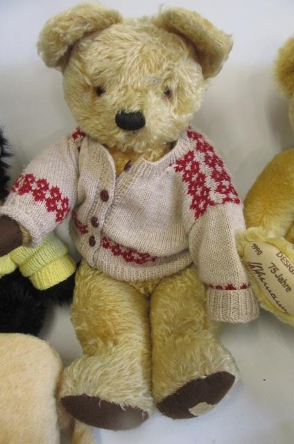A mid 20th century English teddy bear with faded gold plush Image