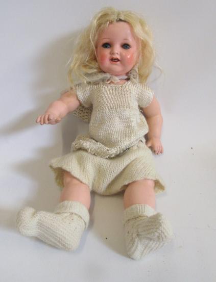 An Ernst Heubach sprayed bisque doll with blue glass sleeping eyes Image