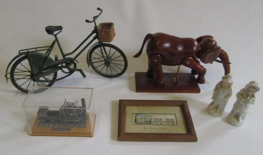 An articulated artists model elephant in hardwood on stand Image