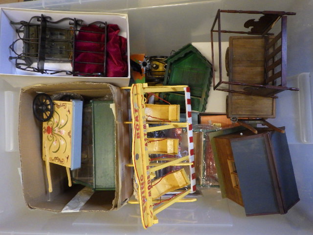 A quantity of miniature buildings and vehicles suitable for dolls house displays Image