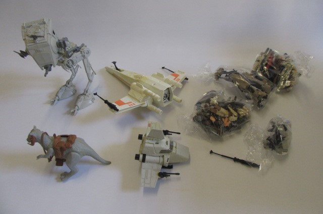 Various Star Wars items including Millenium Falcon and other vehicles Image